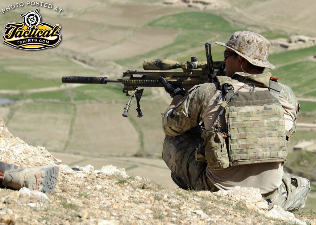 A coalition Special Operations Forces member fires his sniper rifle from a hilltop during a firefight near Nawa Garay village, Kajran district, Daykundi province, Afghanistan, April 3. Coalition SOF partners with the 8th Commando Kandak to conduct operations throughout Daykundi, Uruzgan and Zabul provinces. (U.S. Navy photo by Mass Communication Specialist 2nd Class Jacob L. Dillon / Released)