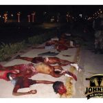 The decapitated bodies of several men lie scattered on a sidewalk in Acapulco
