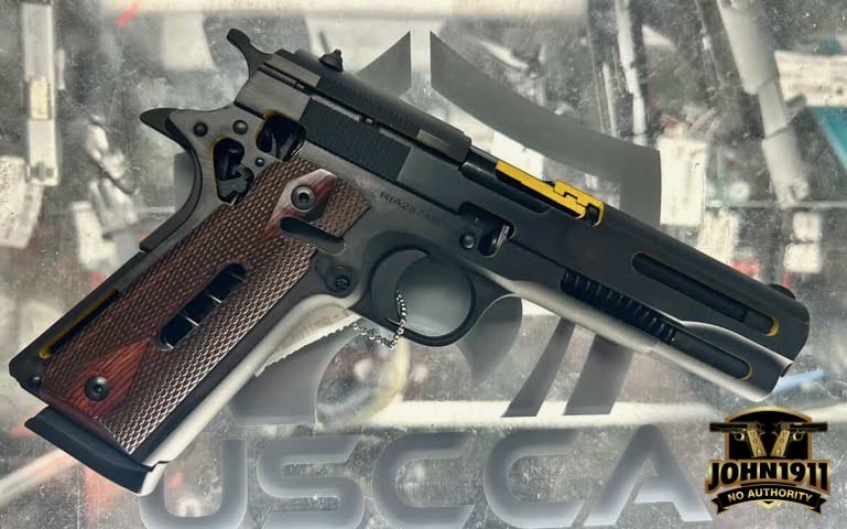 Cutaway 1911 with wood grips.